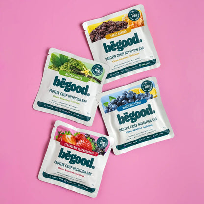 Four packages of begood protein crisp nutrition bars on a pink background