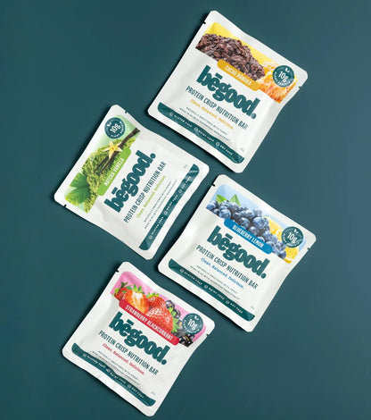 Four packets of Bēgood protein bars on a dark green background