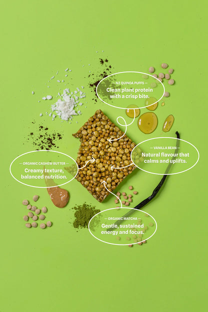 Ingredients of a begood nutrition matcha vanilla bar on a green background with text labels.