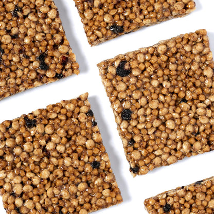 Square begood protein bars with a textured surface on a white background