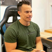 Dave Astley sitting in a chair taking notes